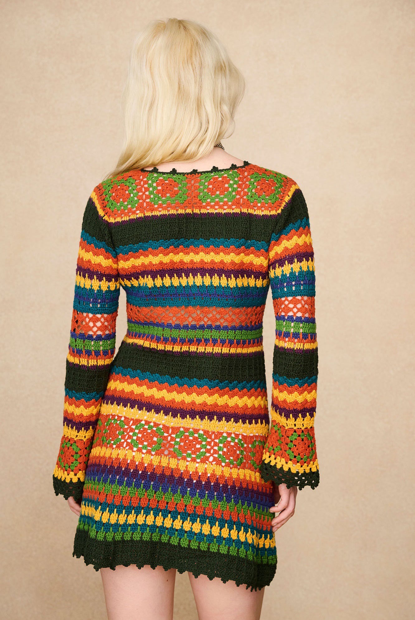 Back view of The Hippie Shake's multicolour striped crochet mini dress.
