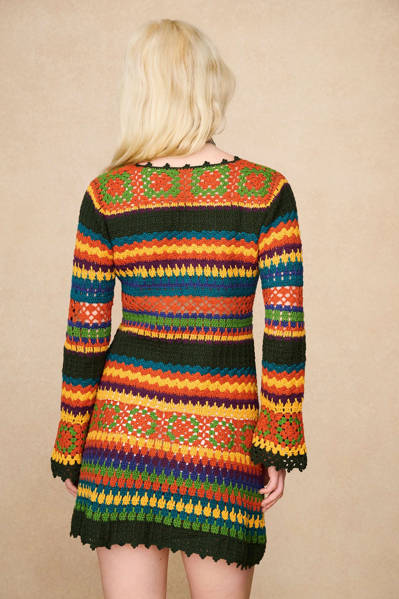 Back view of The Hippie Shake's multicolour striped crochet mini dress.