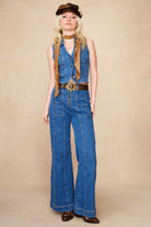 Full outfit shot of The Hippie Shake's chevron flared jeans with matching 70s style denim vest and two-tone baker hat.