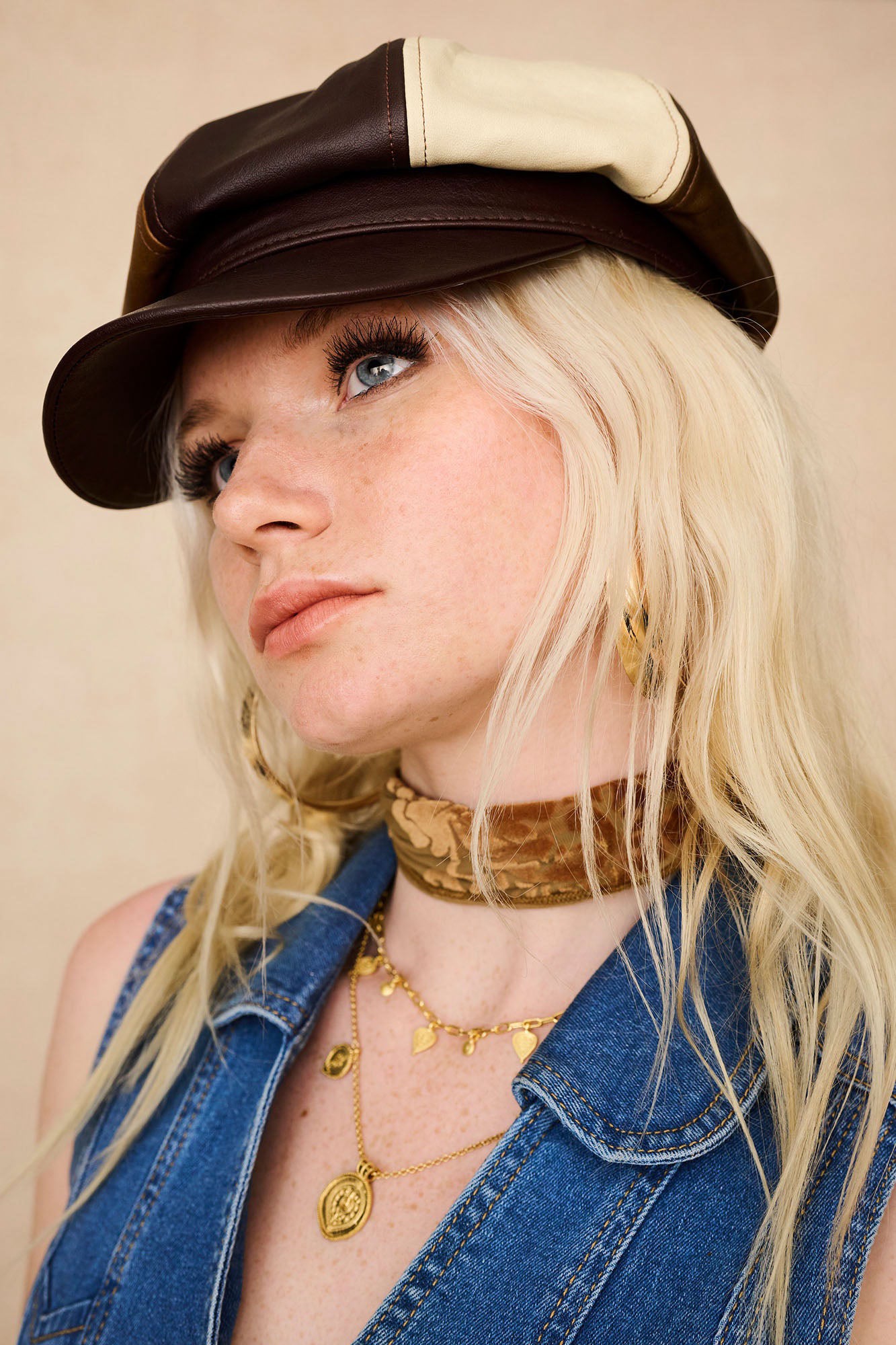 Close-up of The Hippie Shake’s women's panelled baker hat, worn tilted over blonde wavy hair.
