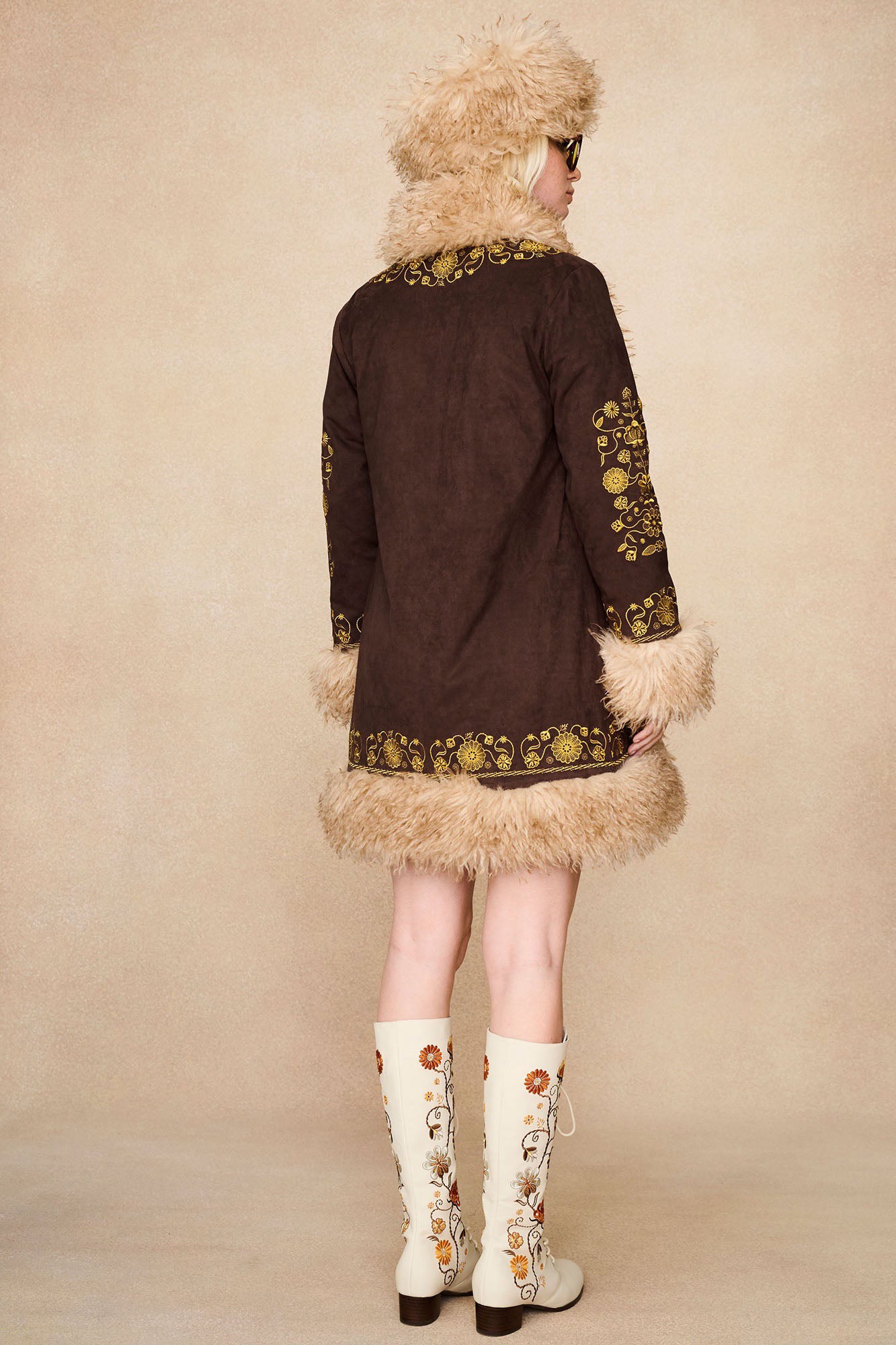 Back view of The Hippie Shake's vintage style cream lace up Penny Lane boots with intricate floral embroidery.