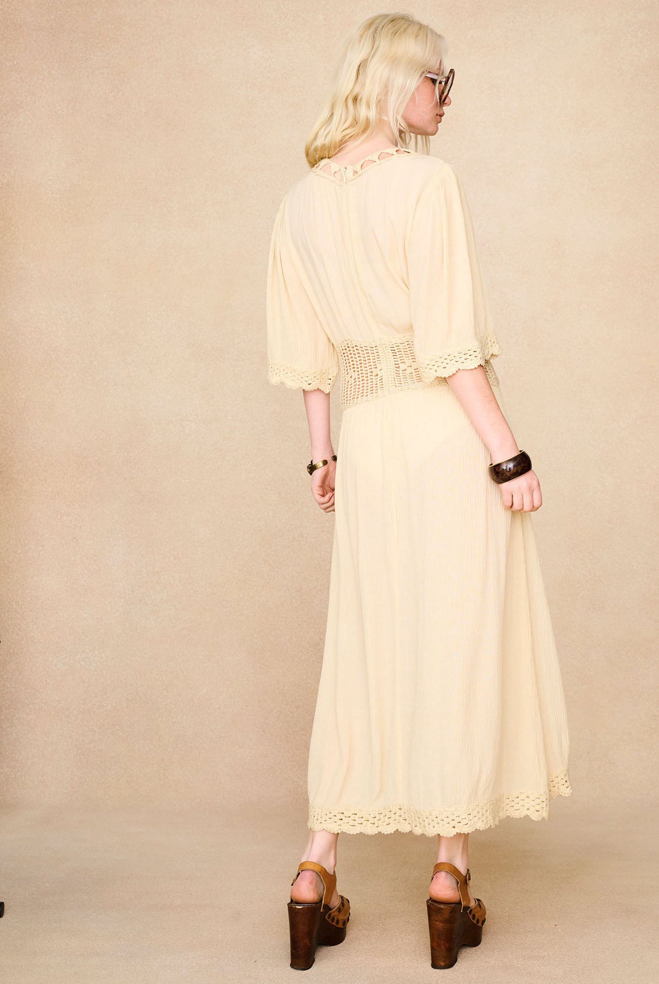 Back view of The Hippie Shake's cream crochet midi dress showing length and fit.