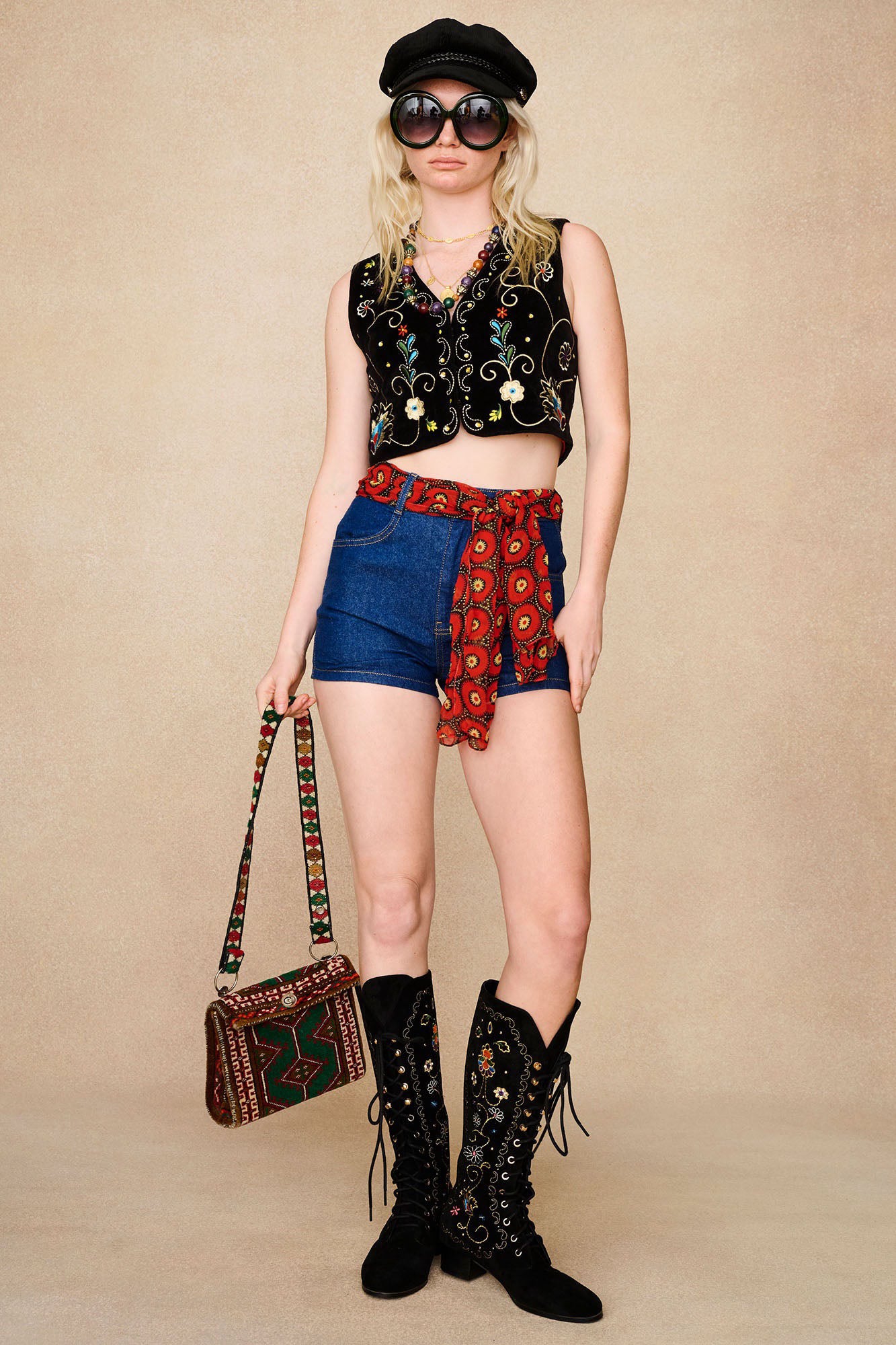 The Hippie Shake's black embroidered boots styled with our black velvet waistcoat vest, corduroy hat and high waisted denim shorts.