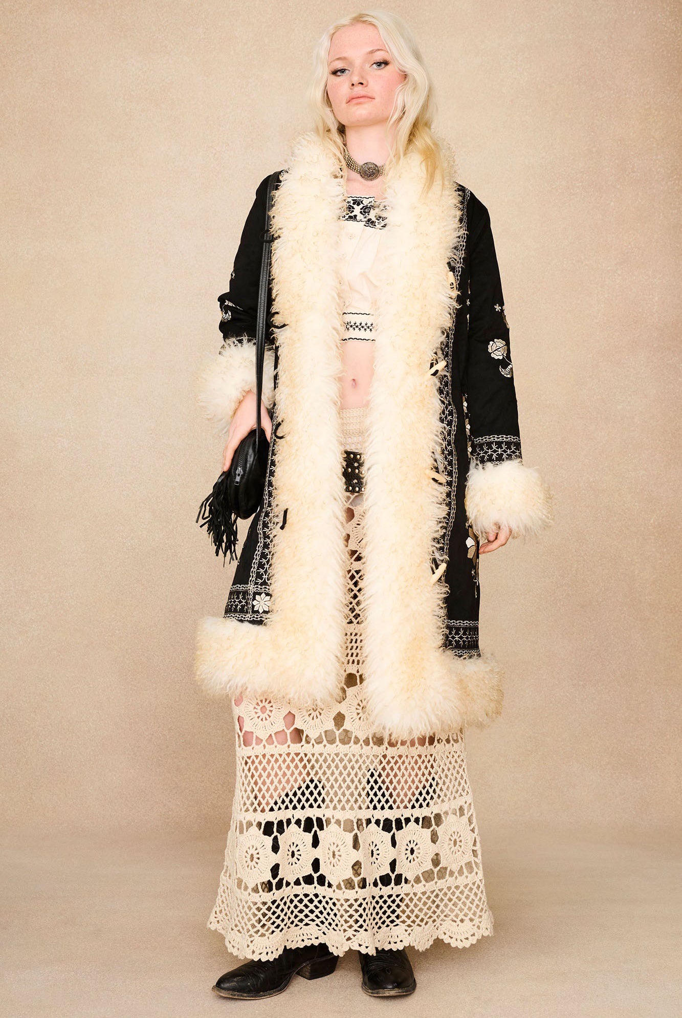The Hippie Shake's black embroidered Penny Lane coat worn open over our cream embroidered crop top and cream maxi skirt.