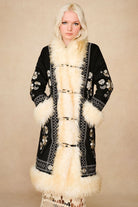 The Hippie Shake's black embroidered Penny Lane coat fastened up over our cream vintage style crochet maxi skirt.