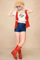 The Hippie Shake's 70s inspired cream floral Penny Lane blouse layered under our red suede waistcoat with vintage boots.
