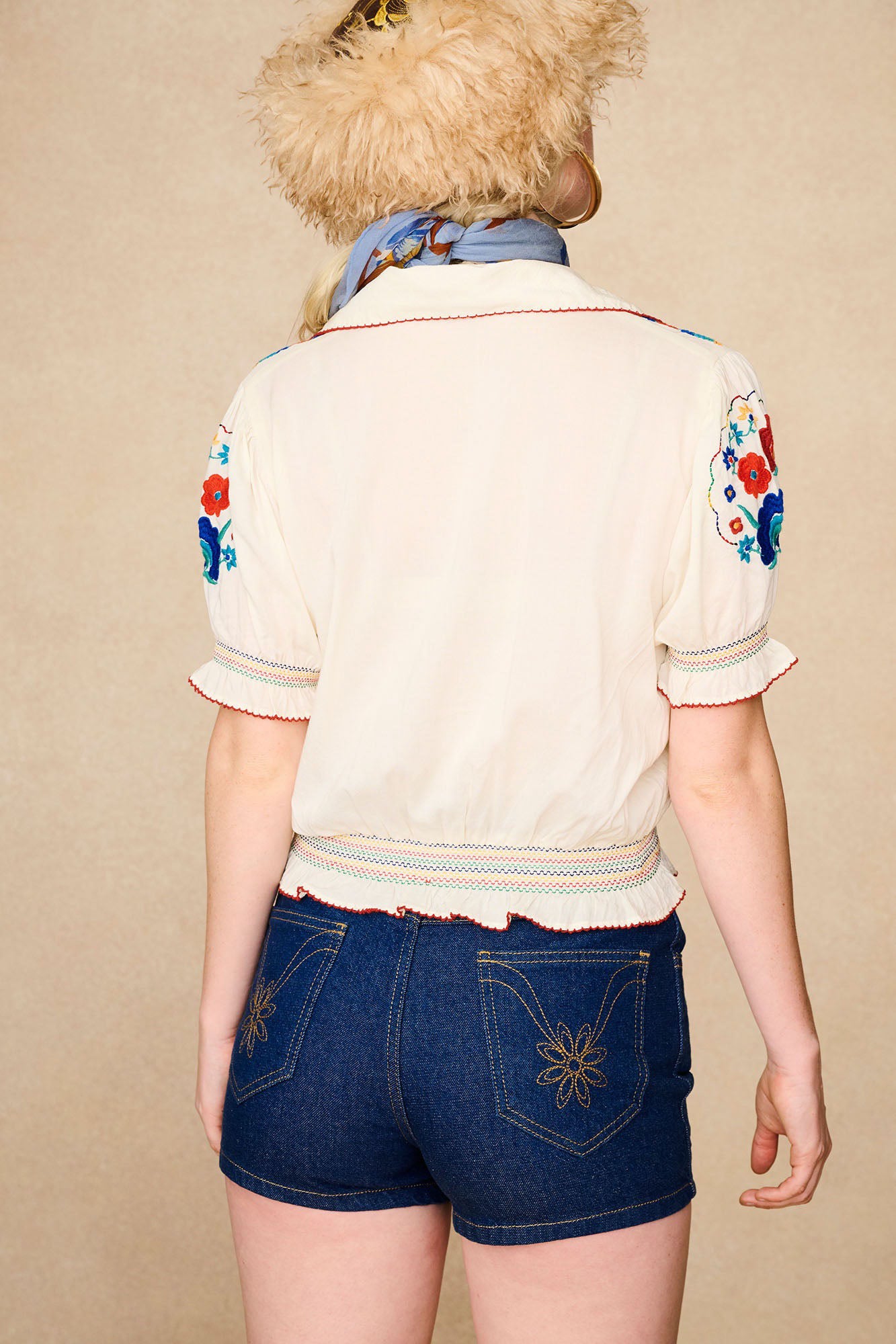 The Hippie Shake's cream floral Penny Lane blouse paired with our denim shorts and blue retro sunglasses.
