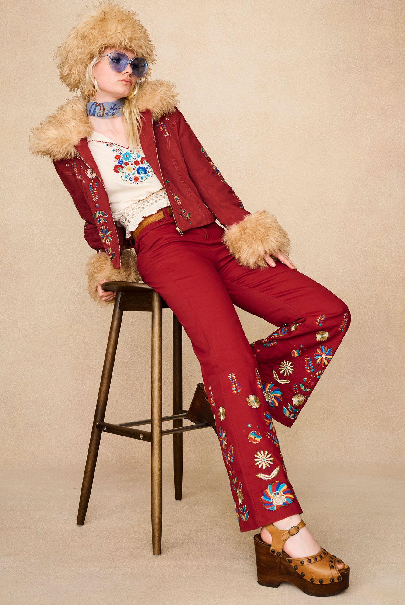 The Hippie Shake's cream floral Penny Lane blouse styled with our red embroidered flares and woven bag.