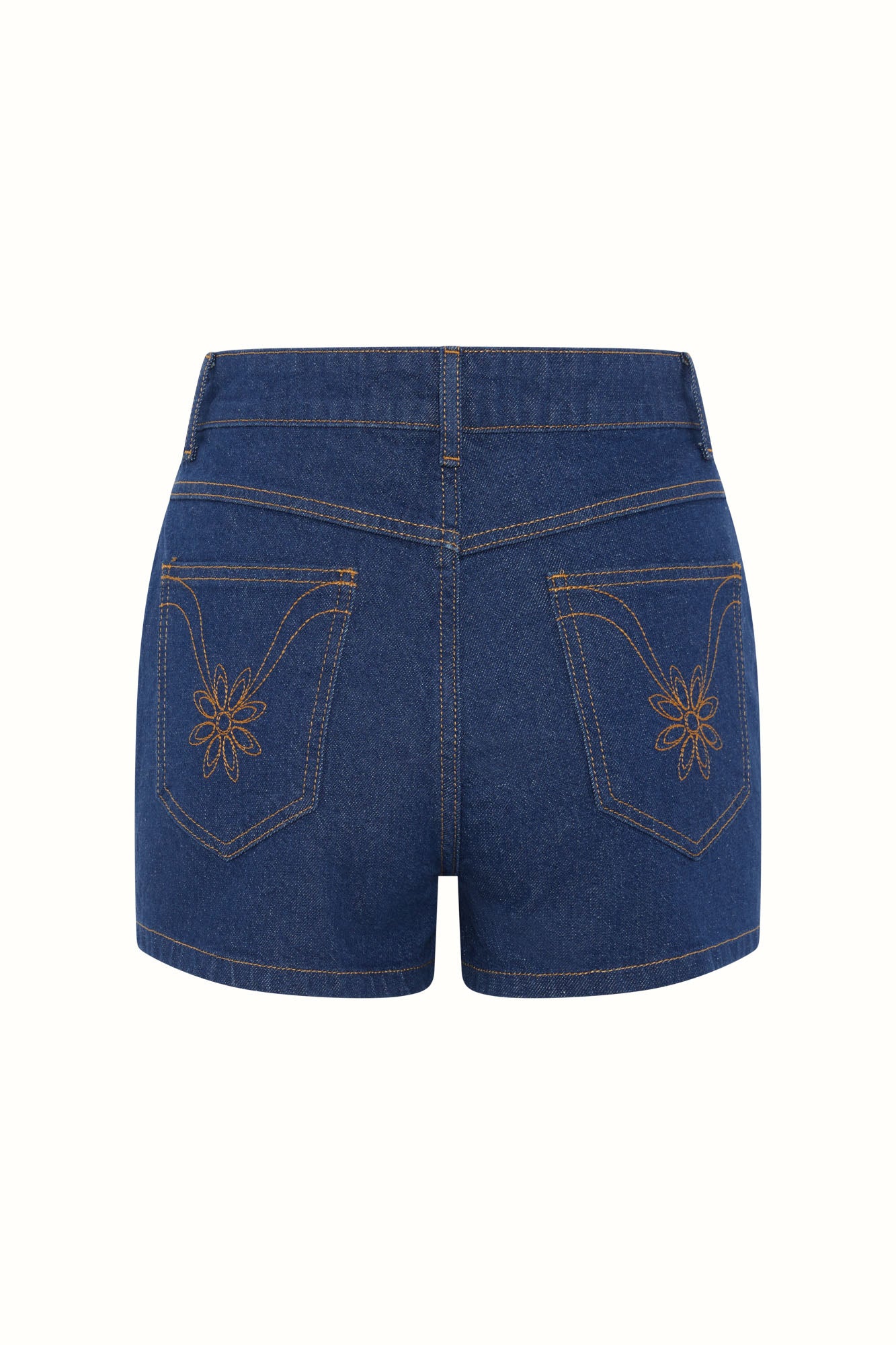 Flat lay of The Hippie Shake's women's high waisted denim shorts showing floral back pocket embroidery.