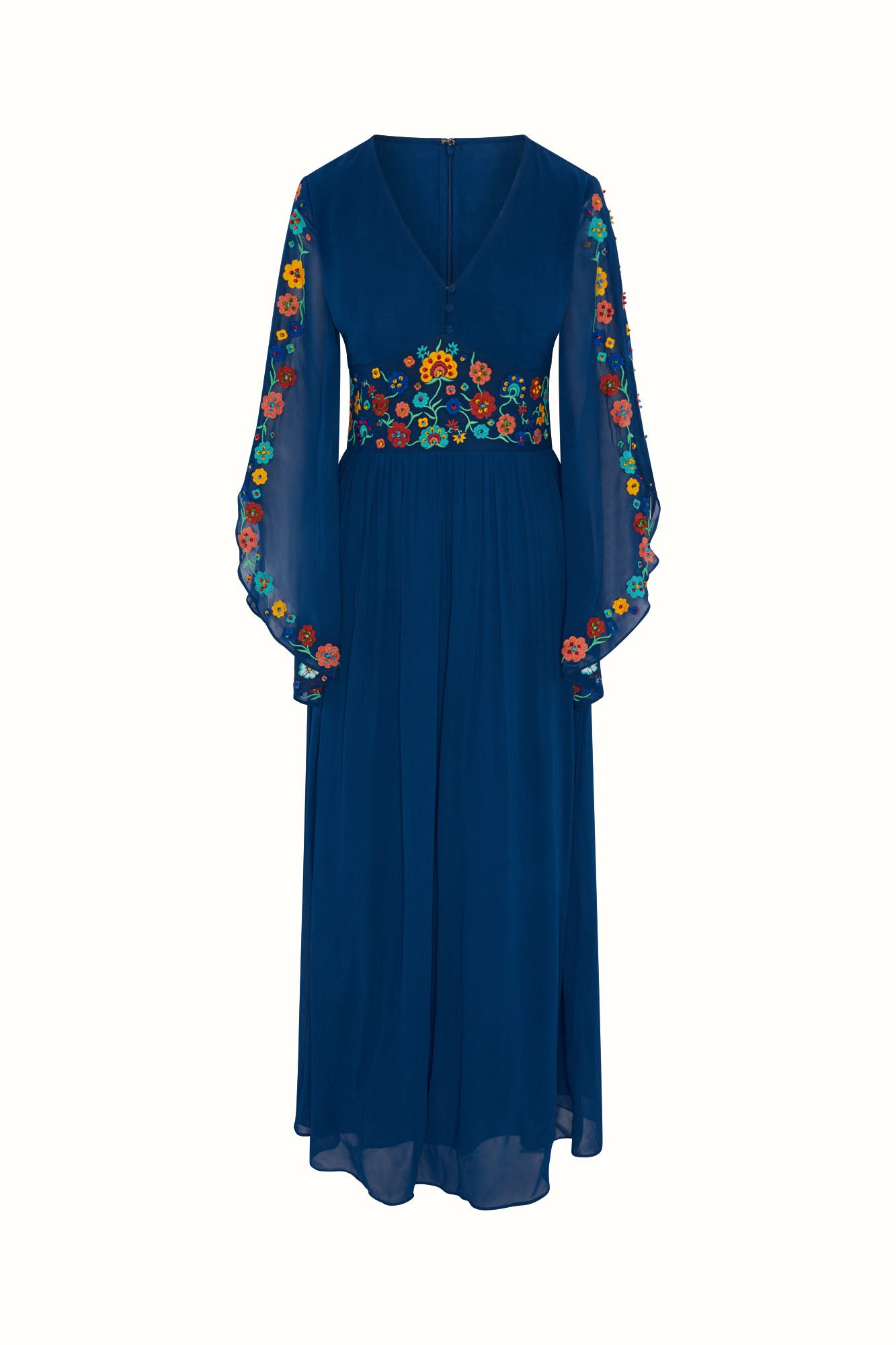 Flat lay of The Hippie Shake's blue floral embroidered maxi dress with flared sleeves and floral embroidery on a white background.