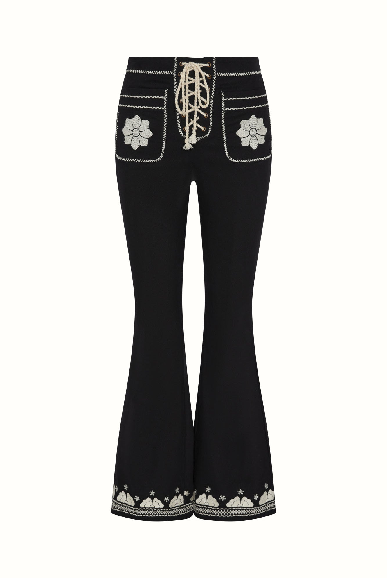 The Hippie Shake's black embroidered floral flared trousers on white background.
