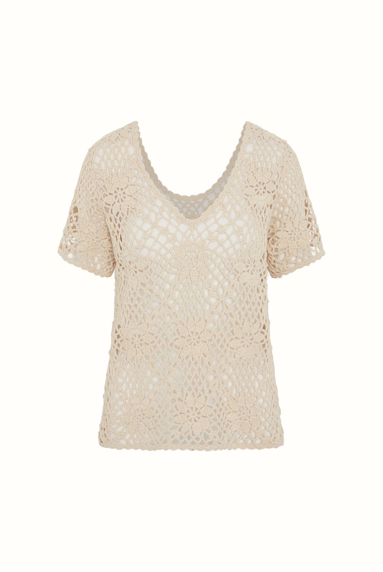 Flat lay of The Hippie Shake's cream floral crochet top with v neckline and intricate floral crochet pattern.