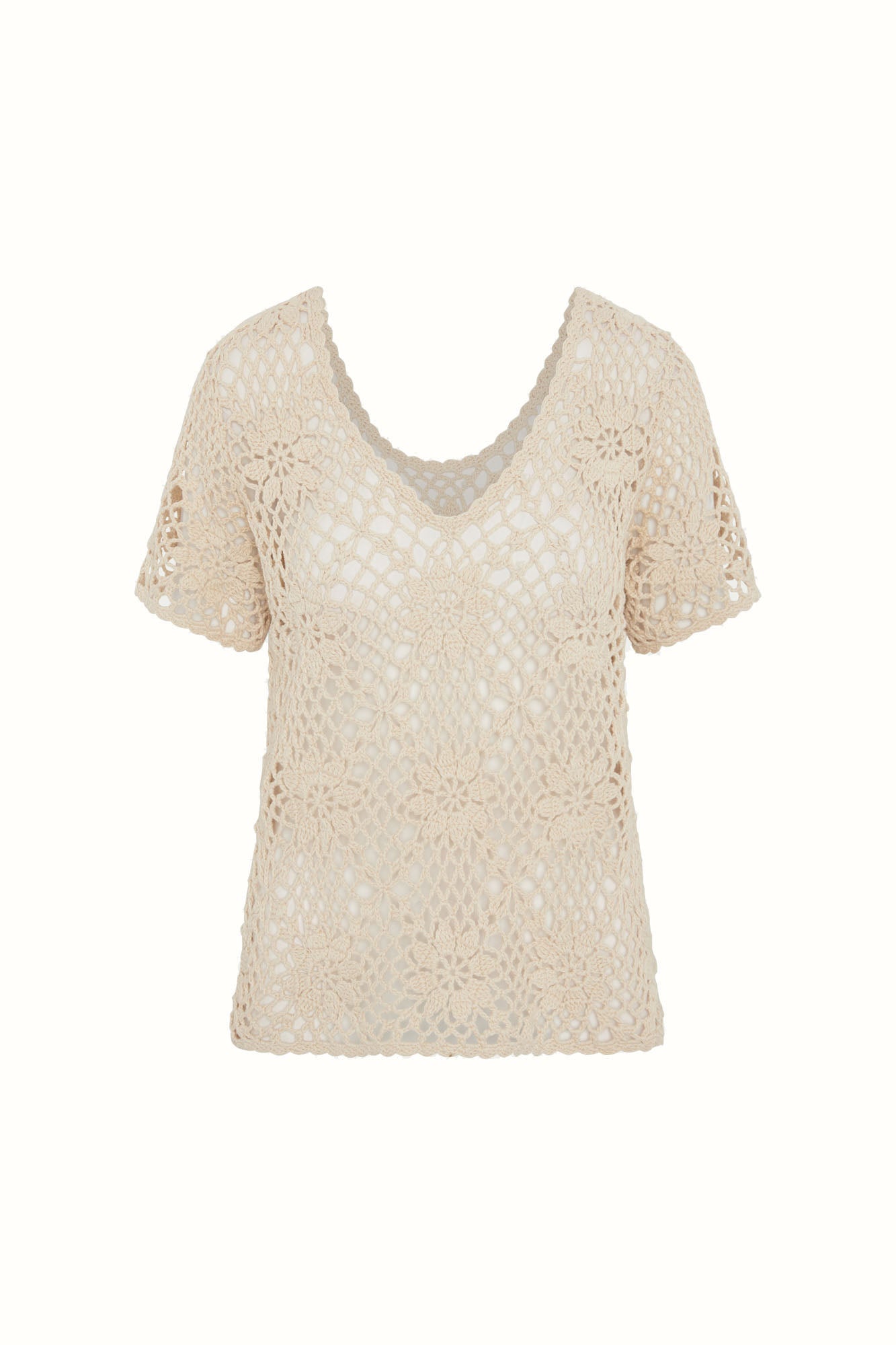 Flat lay of The Hippie Shake's cream floral crochet top with v neckline and intricate floral crochet pattern.