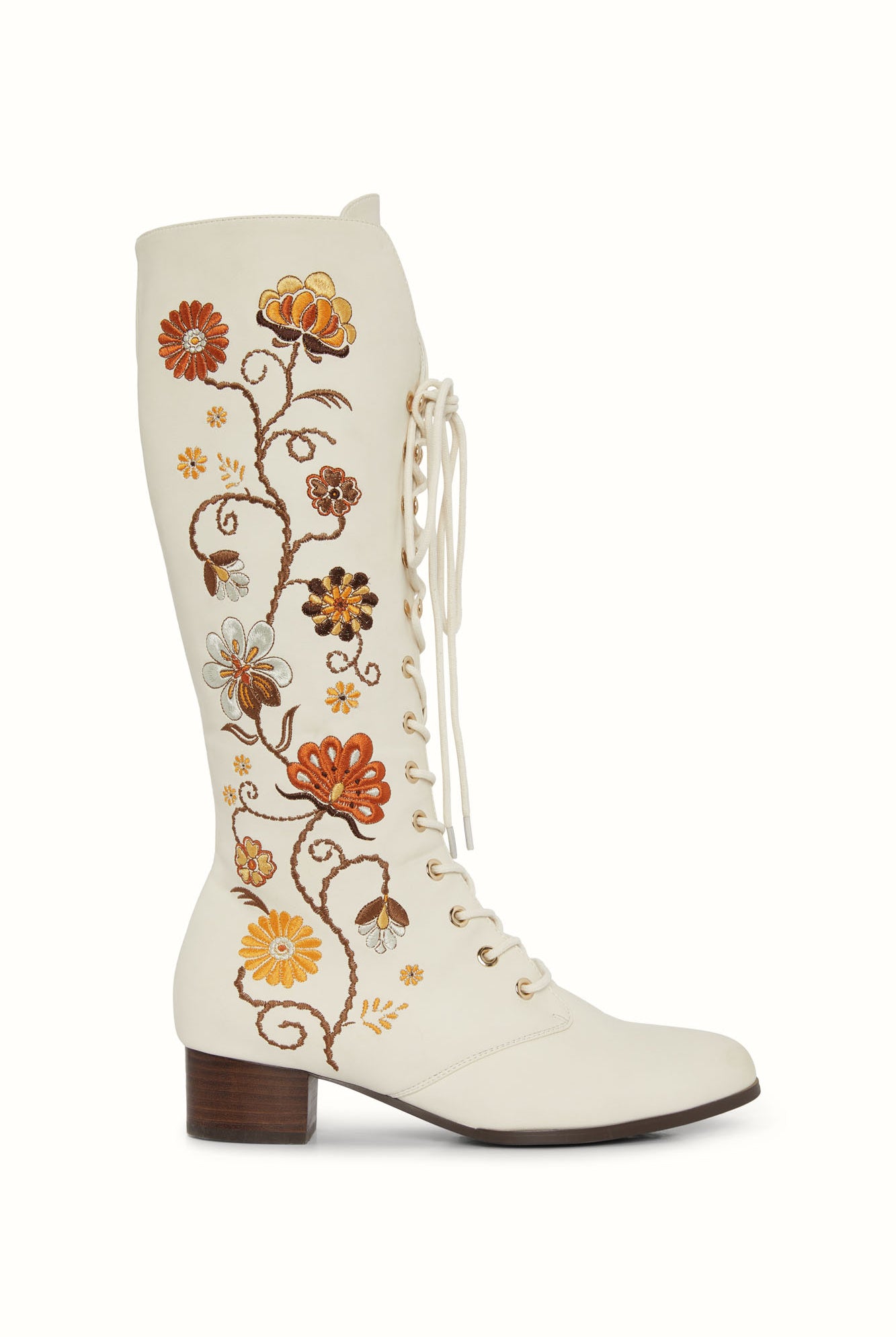 Studio shot of The Hippie Shake's 70s style Penny Lane boots with warm-toned floral embroidery on cream faux leather.