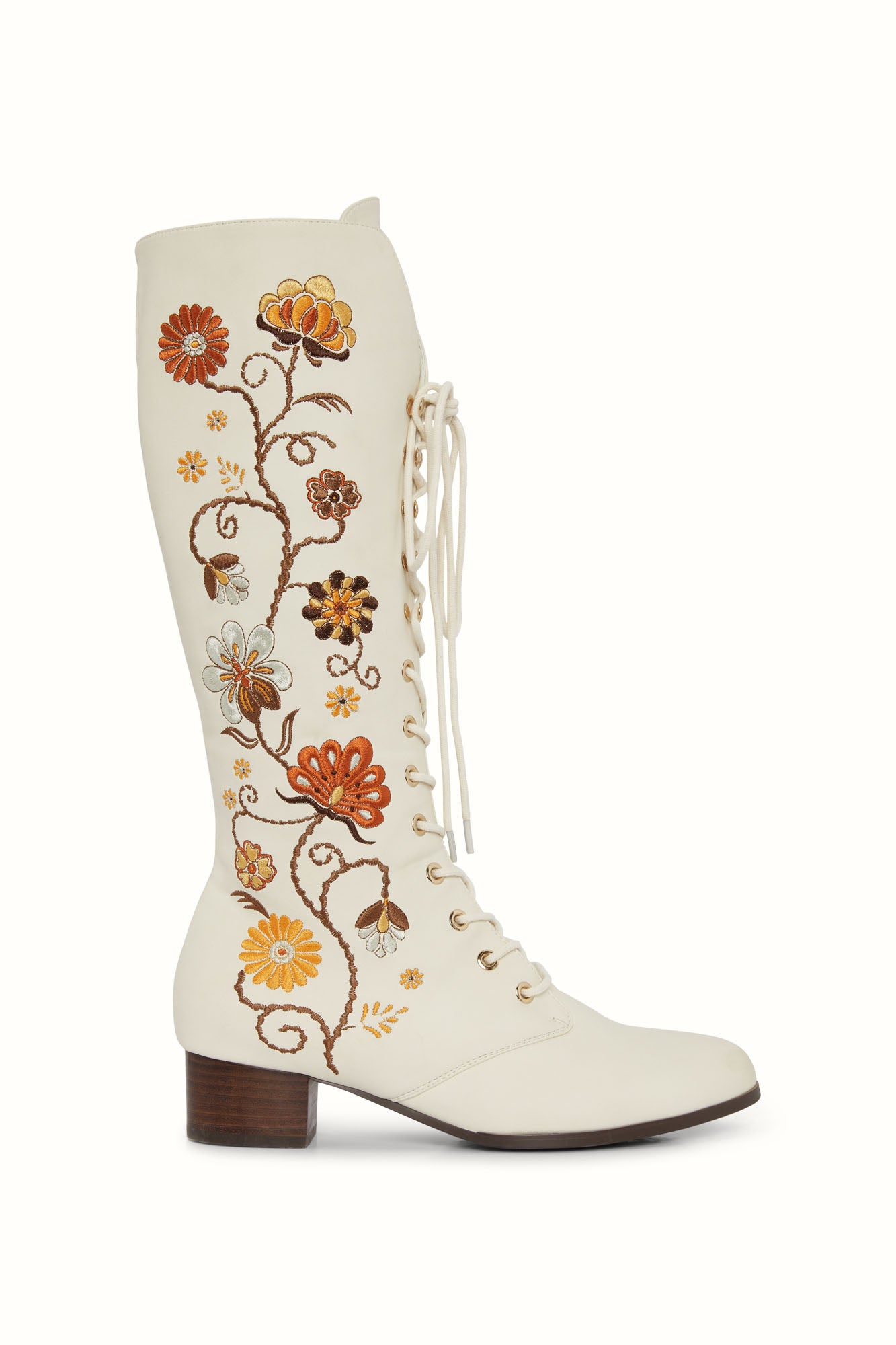 Studio shot of The Hippie Shake's 70s style Penny Lane boots with warm-toned floral embroidery on cream faux leather.