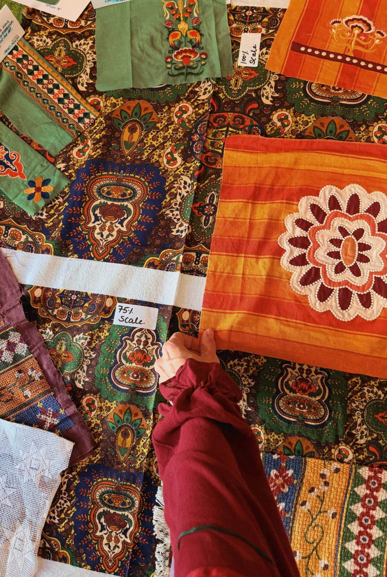 Above view of fabric samples and tapestry prints for The Hippie Shake Magic Caroet Ride collection
