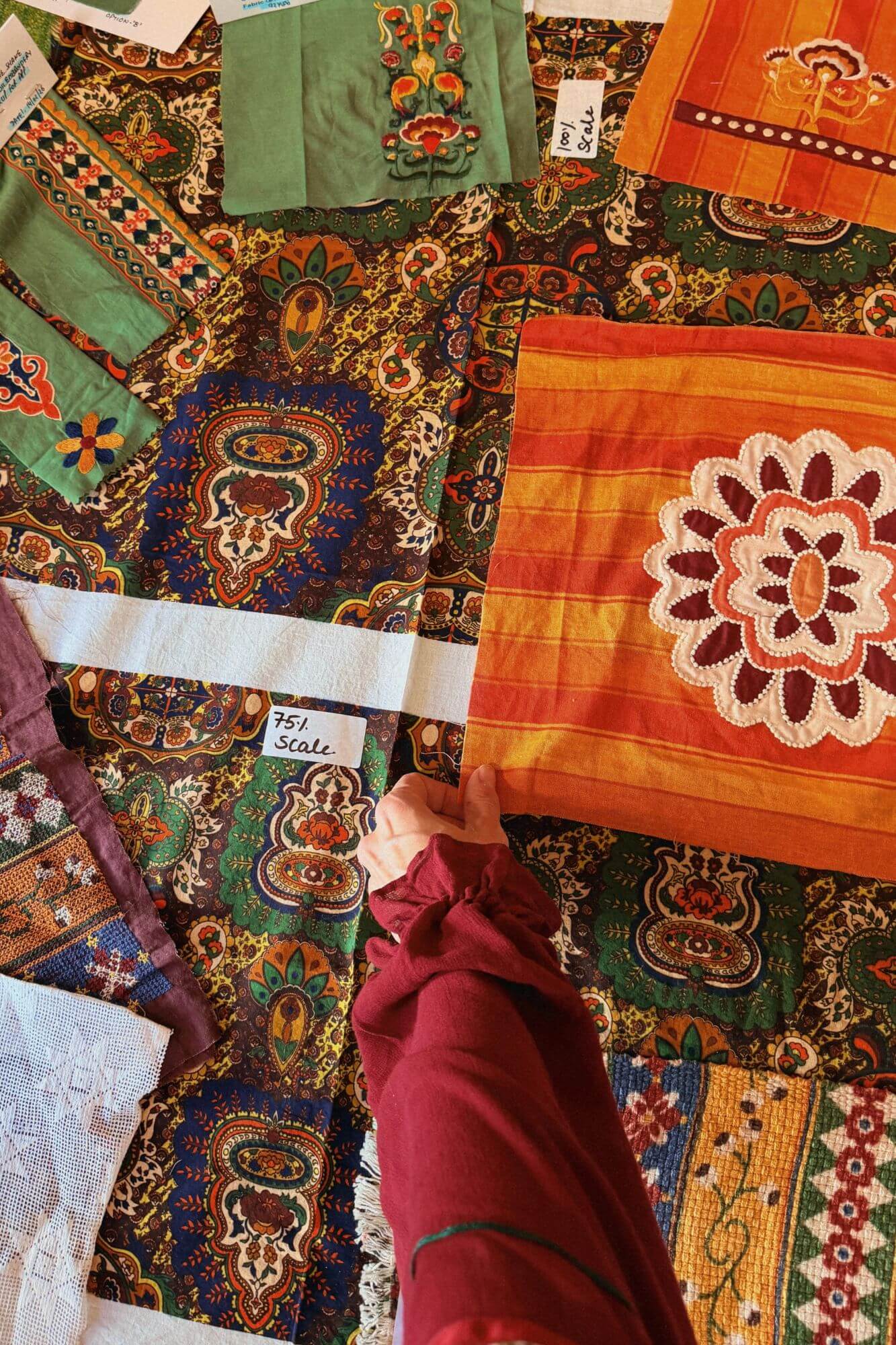 Above view of fabric samples and tapestry prints for The Hippie Shake Magic Caroet Ride collection