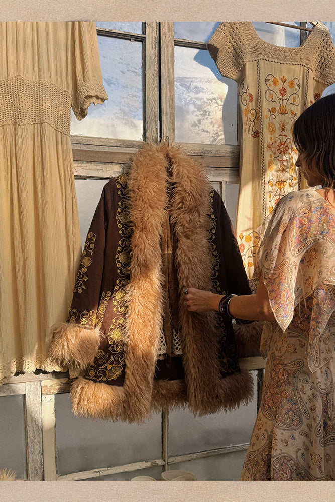 Naomi founder of The Hippie Shake styling a Penny Lane Coat