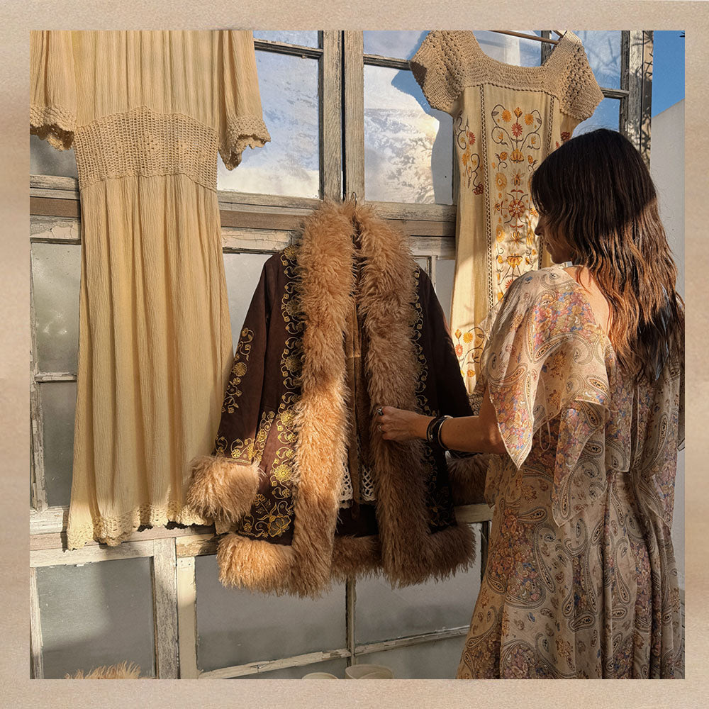 Naomi founder of The Hippie Shake styling a Penny Lane Coat