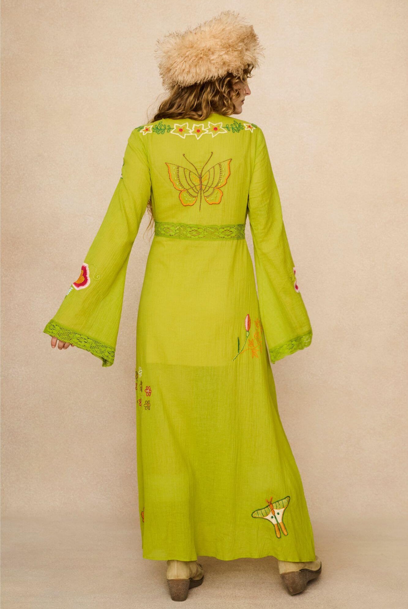 Embroidered Duster crafted from textured green cotton on a model - back view