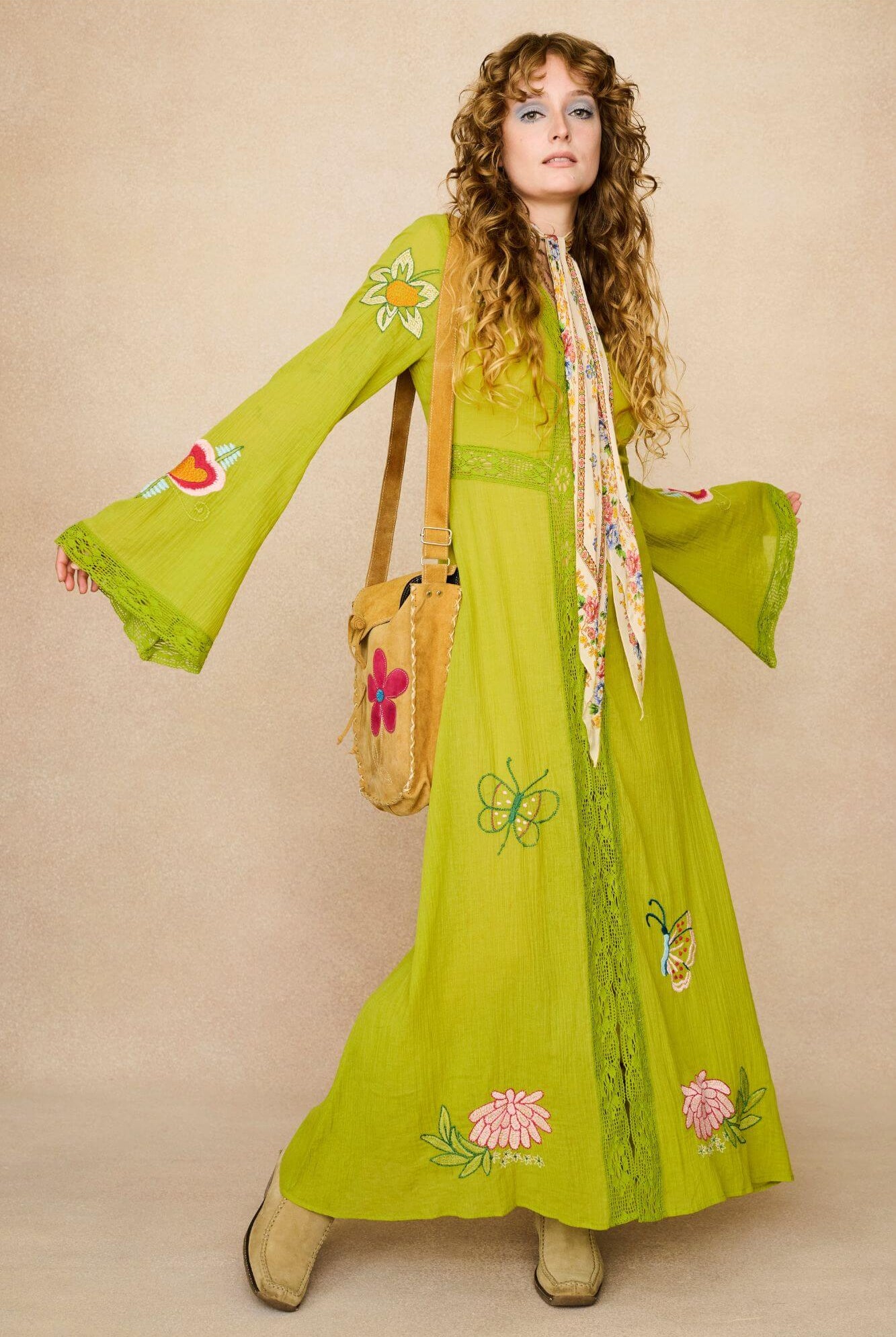 Embroidered Duster crafted from textured green cotton on a model - front view