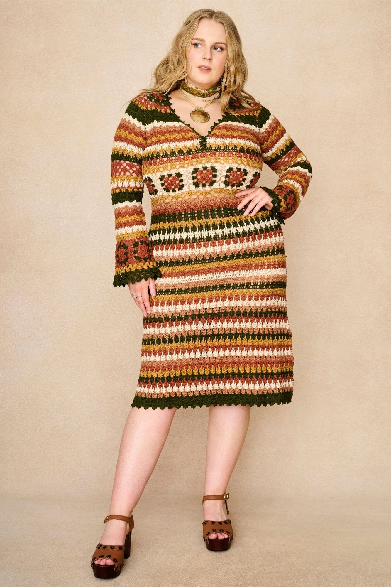 Model wears striped crochet midi dress hand crocheted in cotton with 70s-inspired detailing by The Hippie Shake