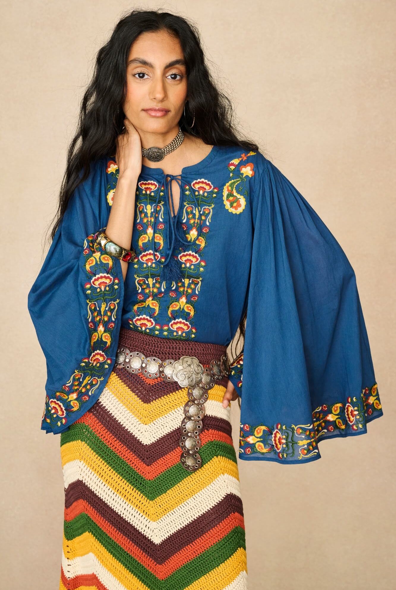 Model wearing 70s blue long sleeve top by The Hippie Shake, front view