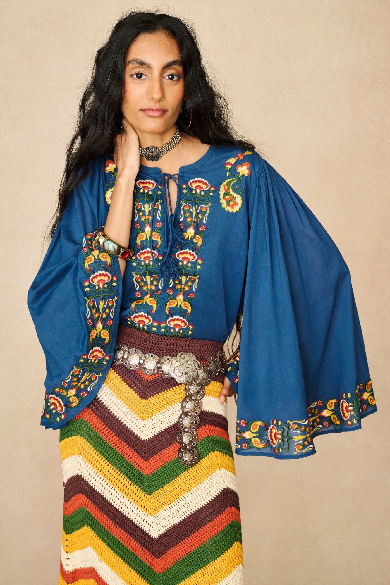 Model wearing 70s blue long sleeve top by The Hippie Shake, front view