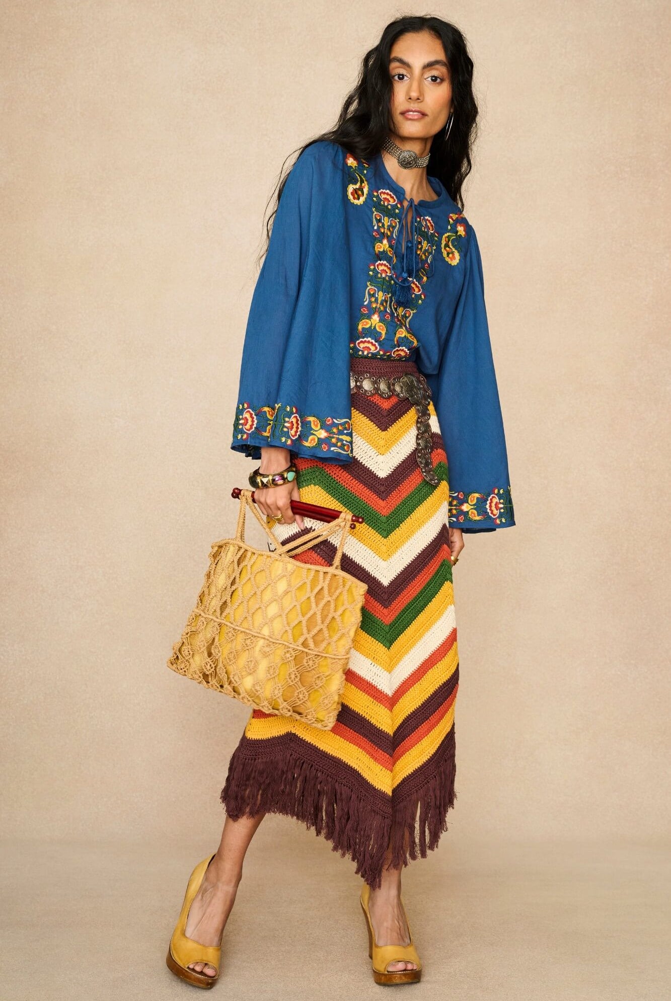 Model wearing 70s blue long sleeve top by The Hippie Shake, front view