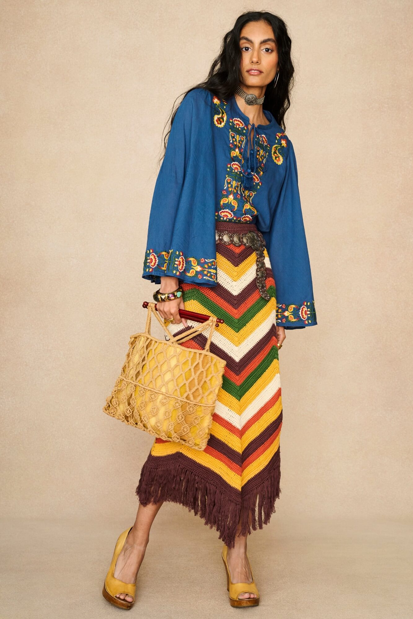 Model wearing 70s blue long sleeve top by The Hippie Shake, front view