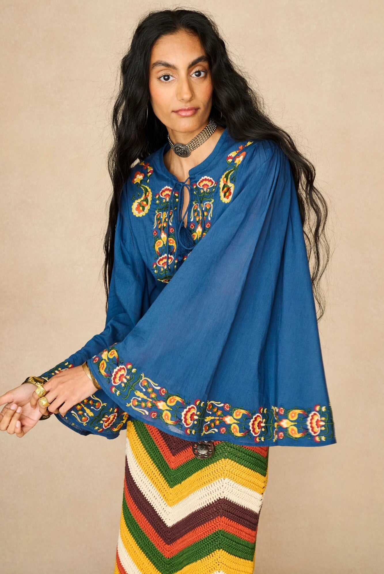 Model wearing 70s blue long sleeve top by The Hippie Shake, close up