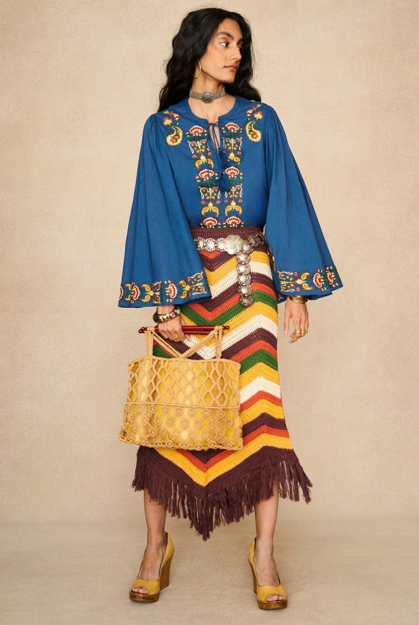 Model wearing 70s blue long sleeve top by The Hippie Shake, front view