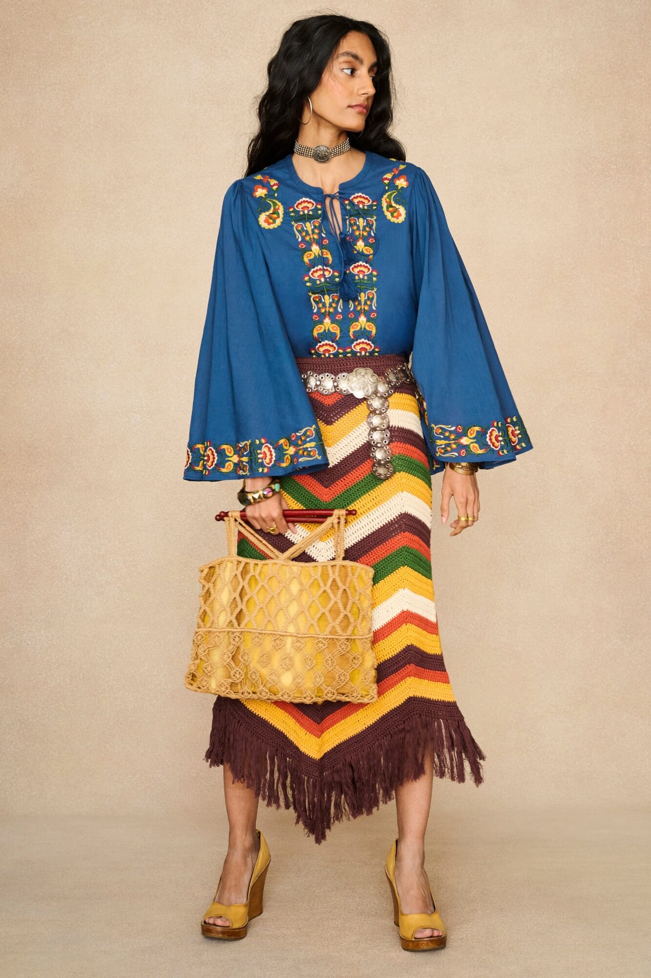 Model wearing 70s blue long sleeve top by The Hippie Shake, front view