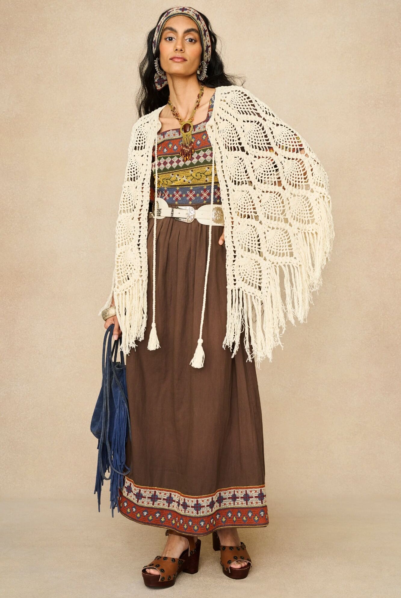 Model wearing brown embroidered maxi dress by The Hippie Shake, front view