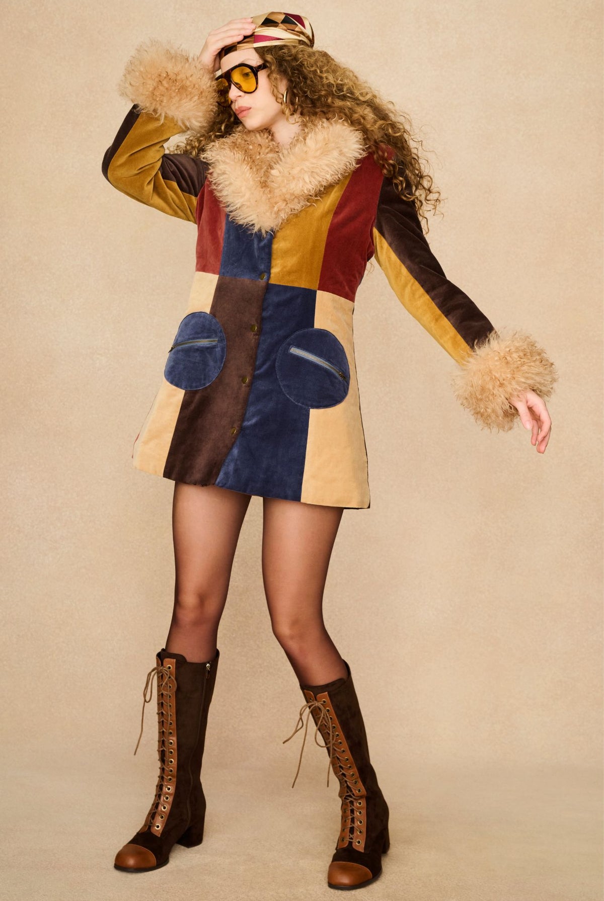 Model wearing 70s patchwork Penny Lane coat with faux-fur collar by The Hippie Shake
