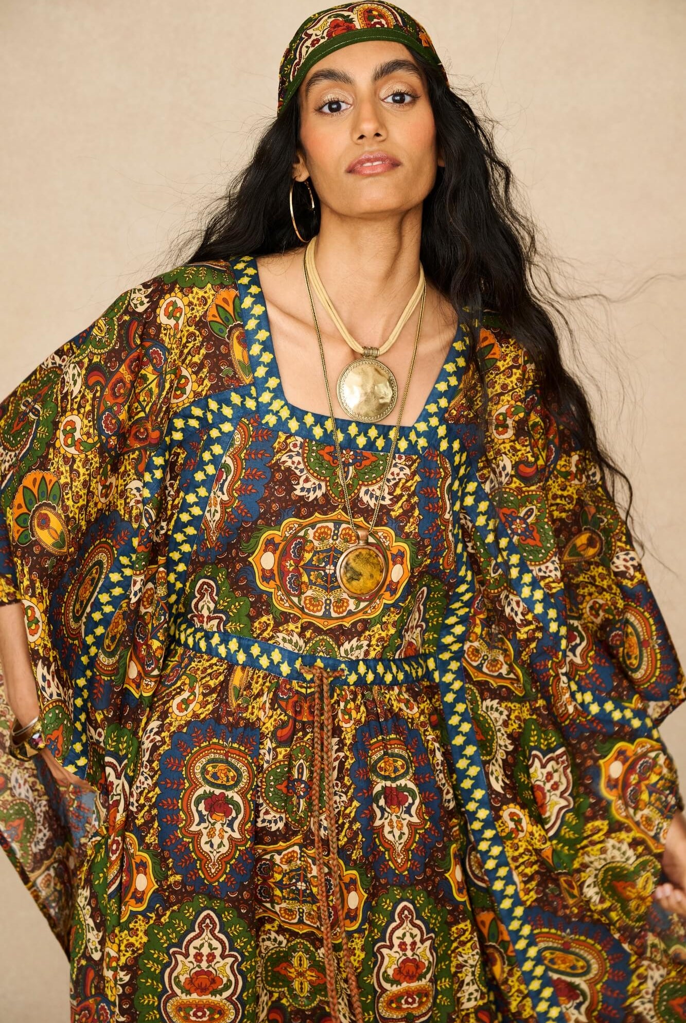 Model wearing 70s printed kaftan by The Hippie Shake, close up