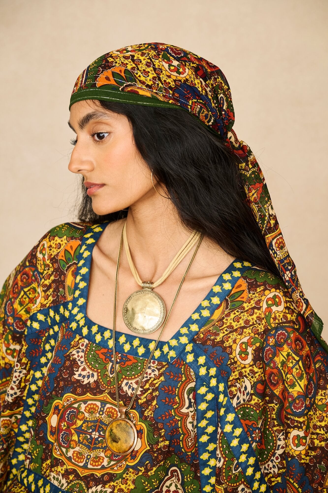 Model wearing 70s printed kaftan by The Hippie Shake, details