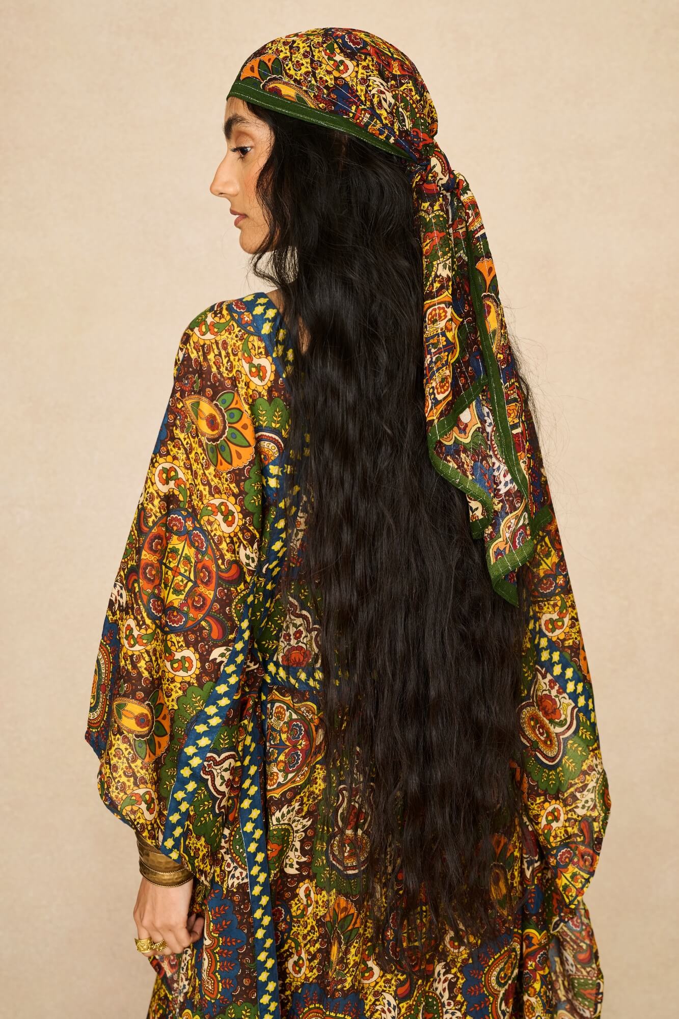 Model wearing 70s printed kaftan by The Hippie Shake, back view