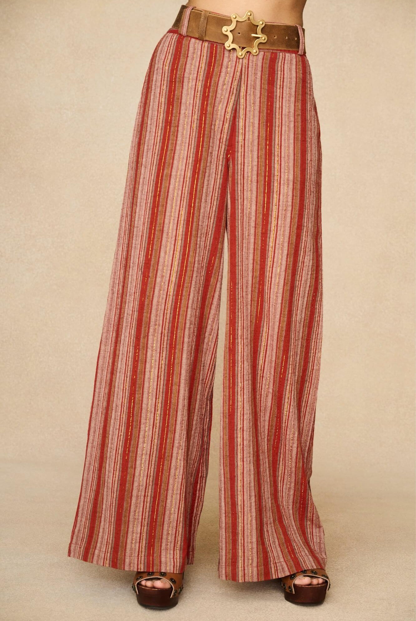 Model wearing striped pants inspired by 70s style with matching striped vest for co-ord outfit, by The Hippie Shake, close up