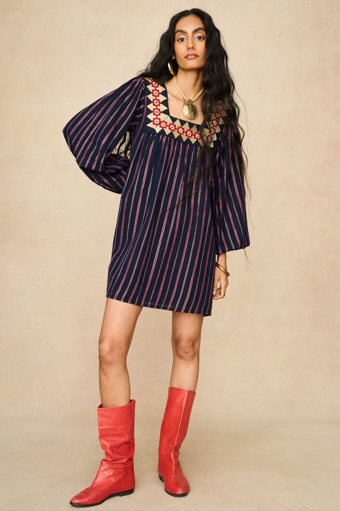 Model wearing 70s striped mini dress by The Hippie Shake, front view
