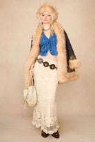 Model draped in The Hippie Shake's brown embroidered Penny Lane coat with our denim waistcoat and cream crochet maxi skirt. 