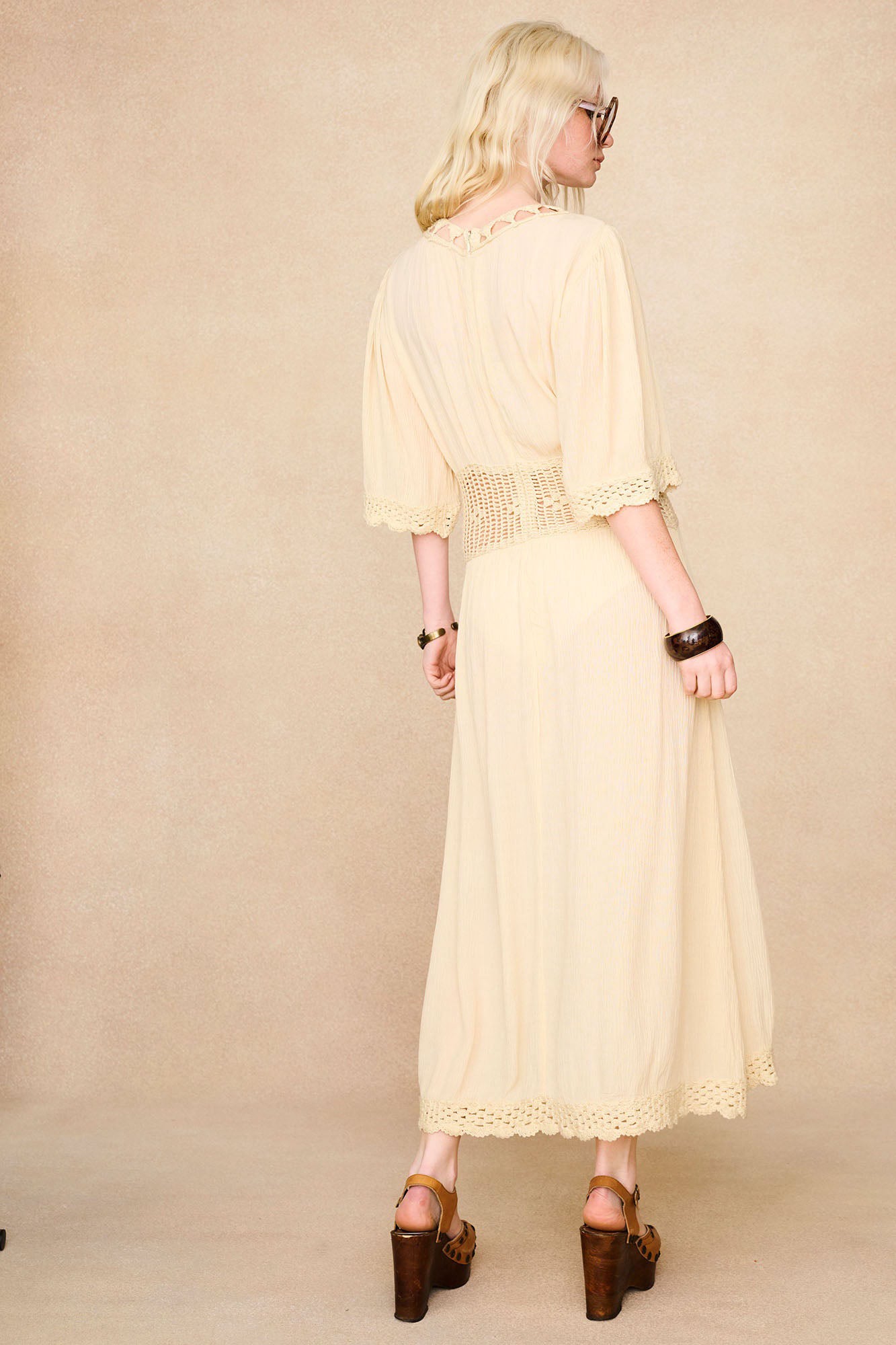 Back view of The Hippie Shake's cream crochet midi dress showing length and fit.