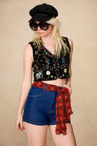 Back view of The Hippie Shake's women's high waisted denim shorts showing floral pocket embroidery.