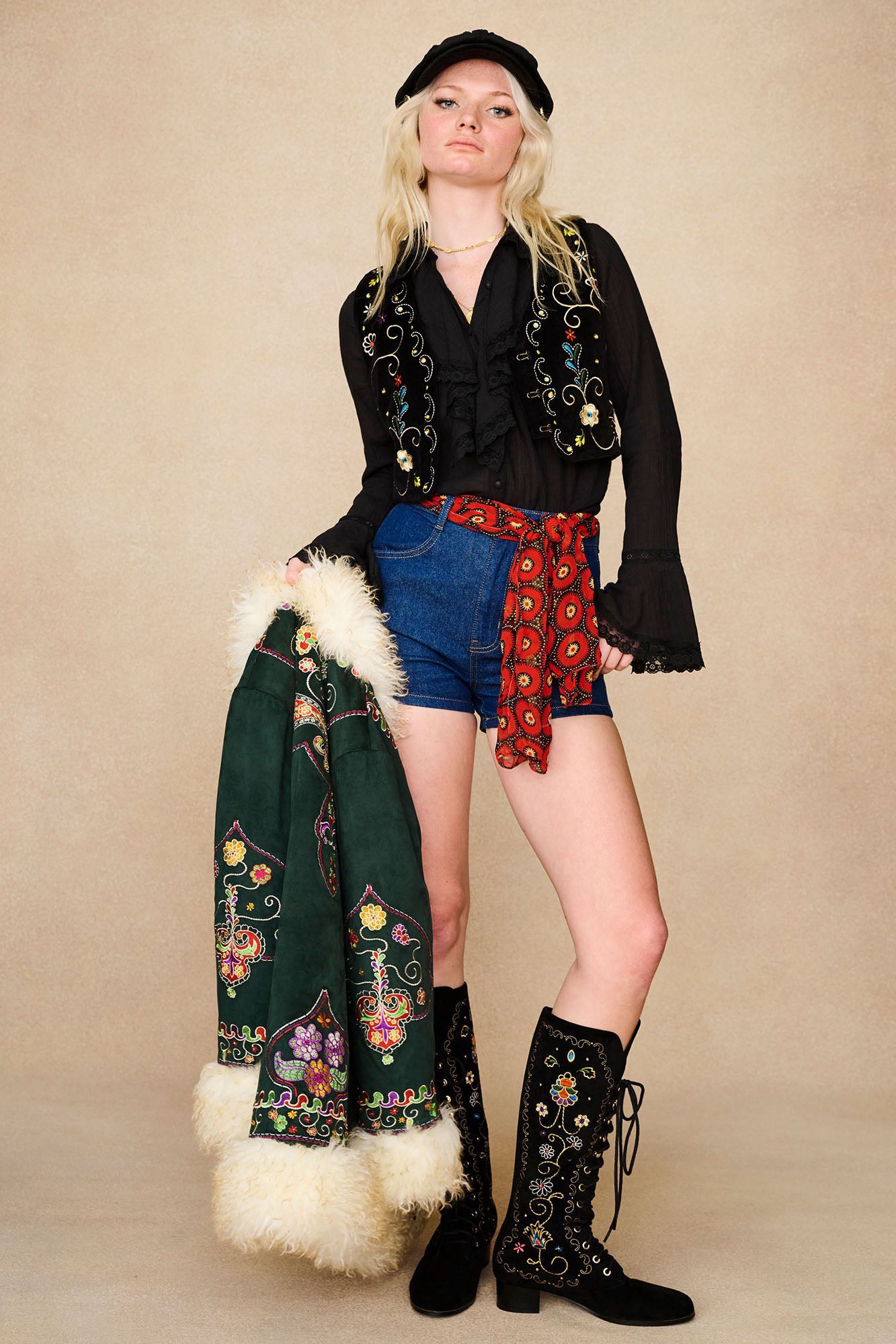 The Hippie Shake's black velvet embroidered waistcoat, layered over our black lace trim ruffle blouse, featuring our green Penny Lane coat.