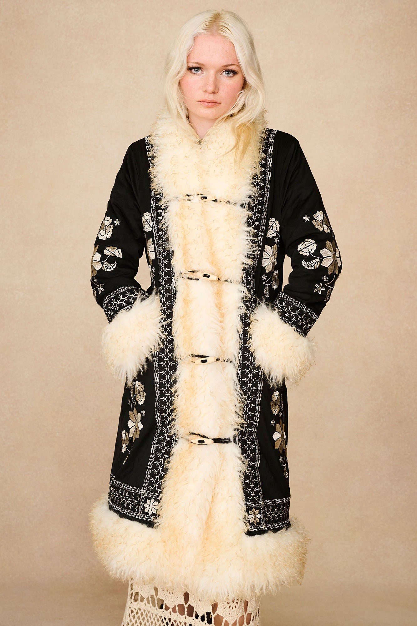 The Hippie Shake's black embroidered Penny Lane coat fastened up over our cream vintage style crochet maxi skirt.