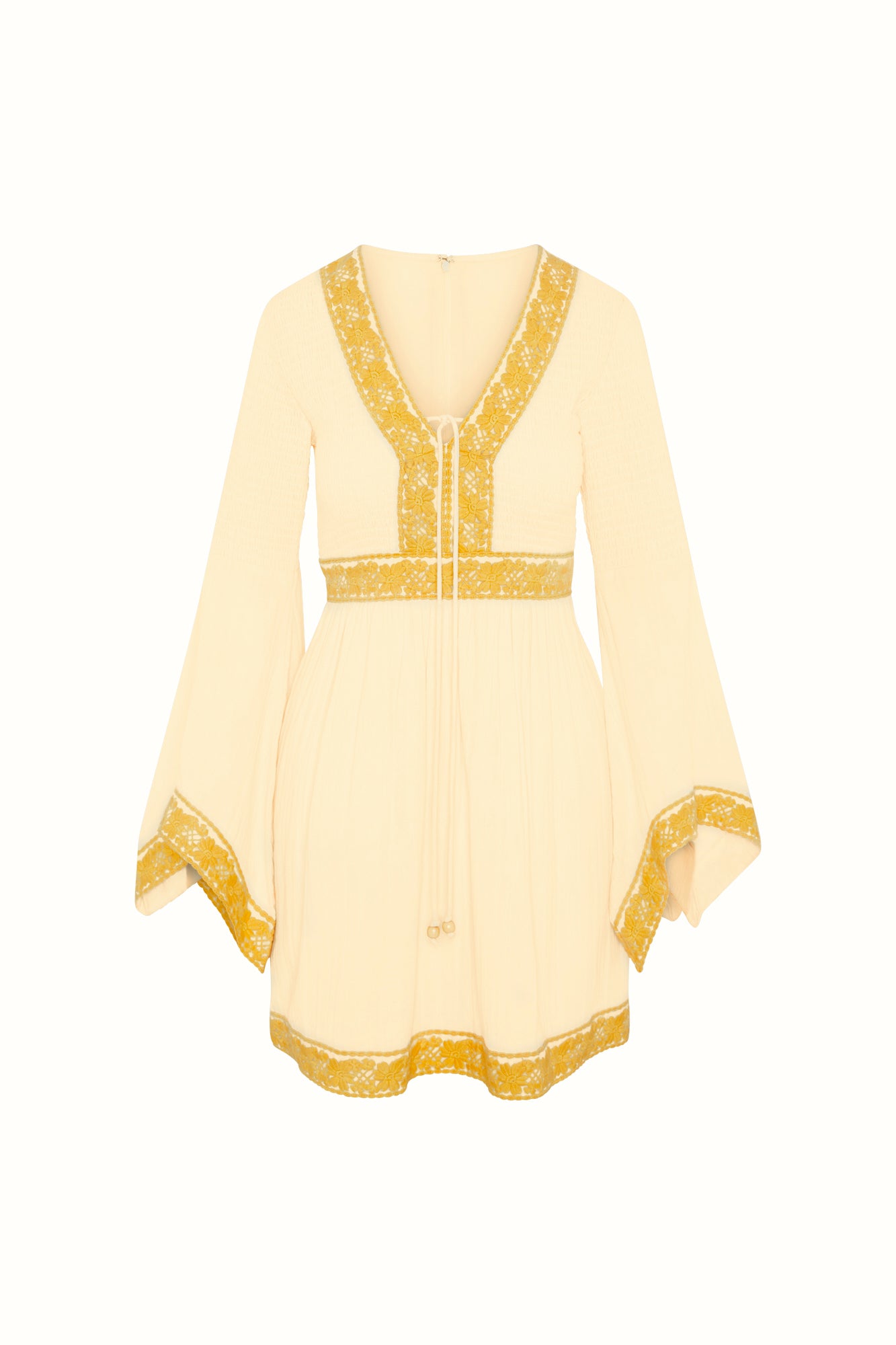 Flat lay of The Hippie Shake's cream lace trim mini dress featuring yellow floral trims and bell sleeves.