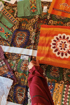 Above view of fabric samples and tapestry prints for The Hippie Shake Magic Caroet Ride collection