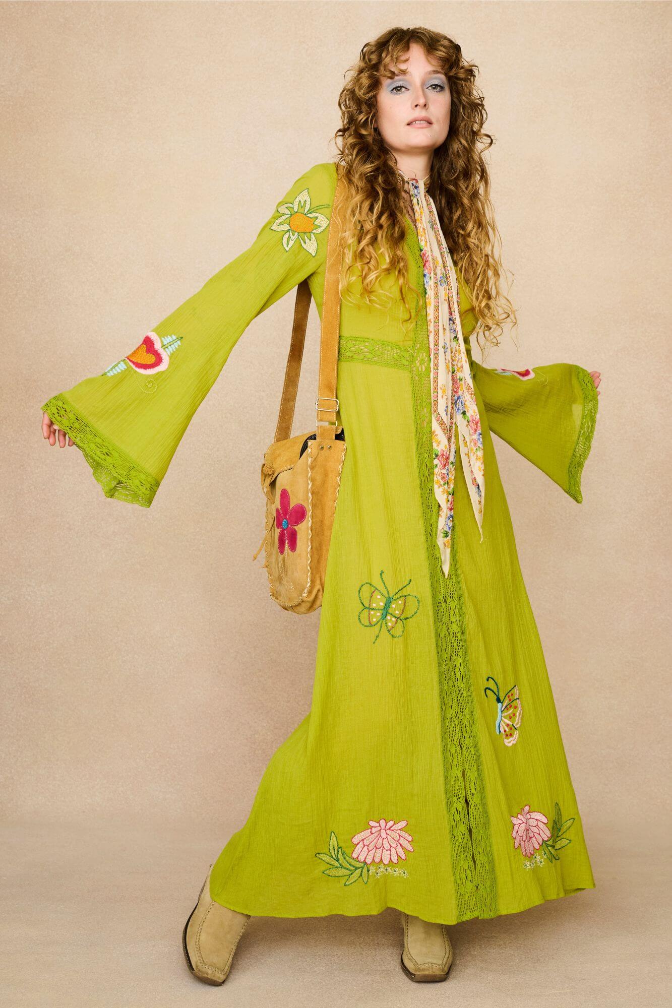 Embroidered Duster crafted from textured green cotton on a model - front view