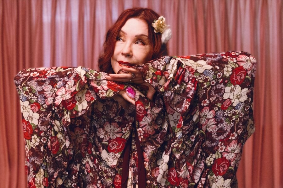 Pamela wearing a floral cape top from The Hippie shake