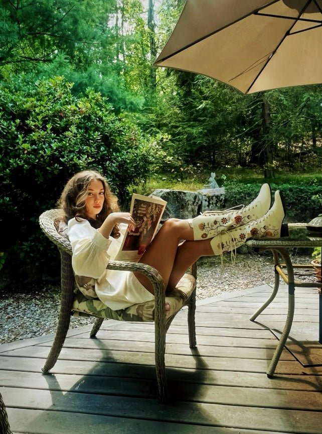 UGC of @aavaamilo wearing The Hippie Shake Penny Lane cream lace up embroidered boots